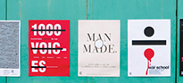 5 posters side by side on a green wall