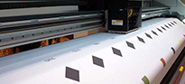 A large side of vinyl being digitally printed