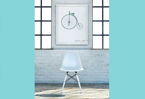 An A2 poster that has been framed with penny farthing design