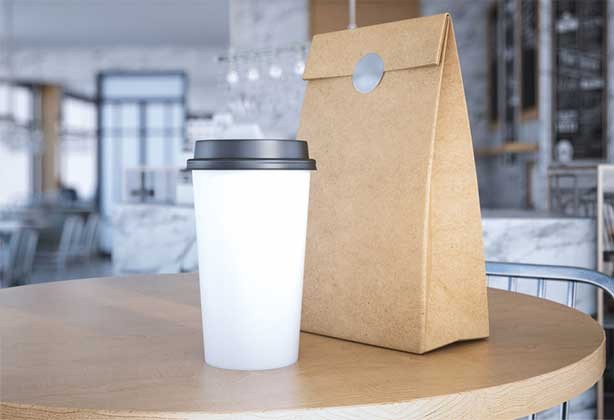Greay circular sticker on a brown paper bag