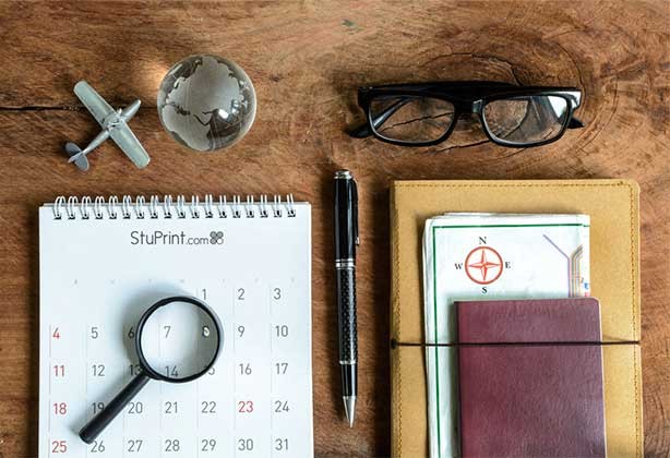 Desk calendar lying on mahogany desk