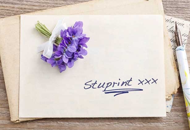 Handwritten wedding invite on cream paper