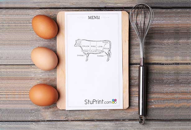 A5 menu design lying next do eggs